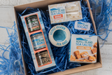Achill Island Sea Salt Products in a hamper with blue shredded paper
