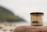 Achill Island Smoked Sea salt with blurred coastal background 