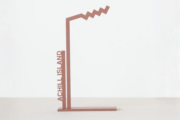 Decorative metal stand with 'Achill Island' text on a white background