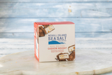 Box of Achill Island Seasalt chocolate cashew nougat on a marble surface with a blurred background