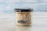 Jar of Achill Island Smoked Sea Salt on a light background